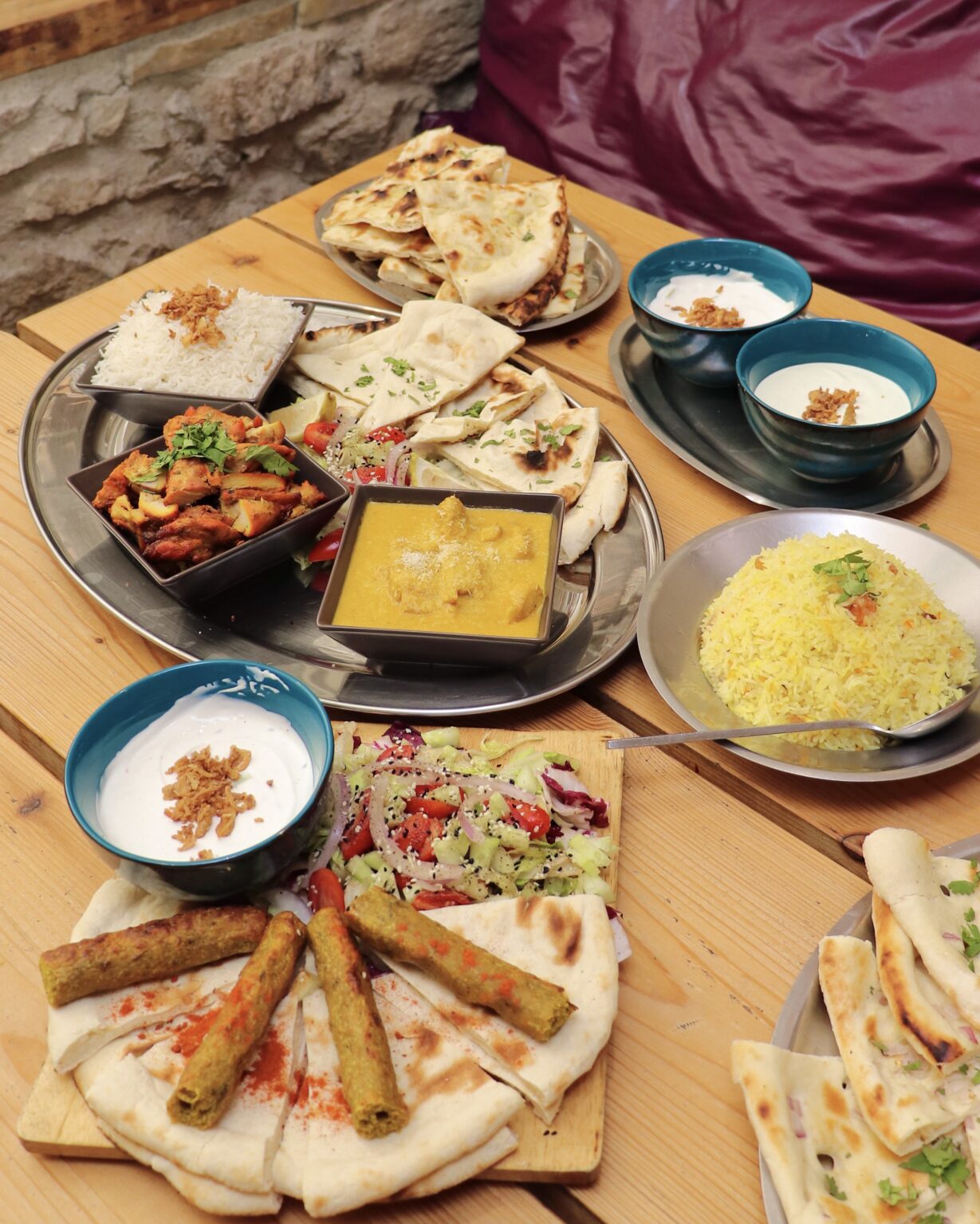 table with a lot of indian plates